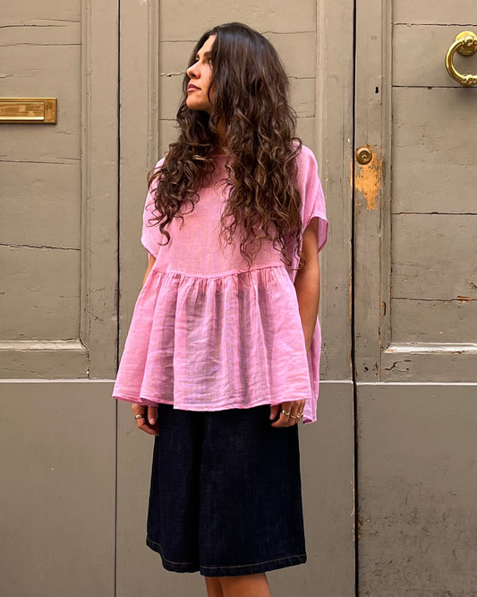 Top con balza a righe rosa
