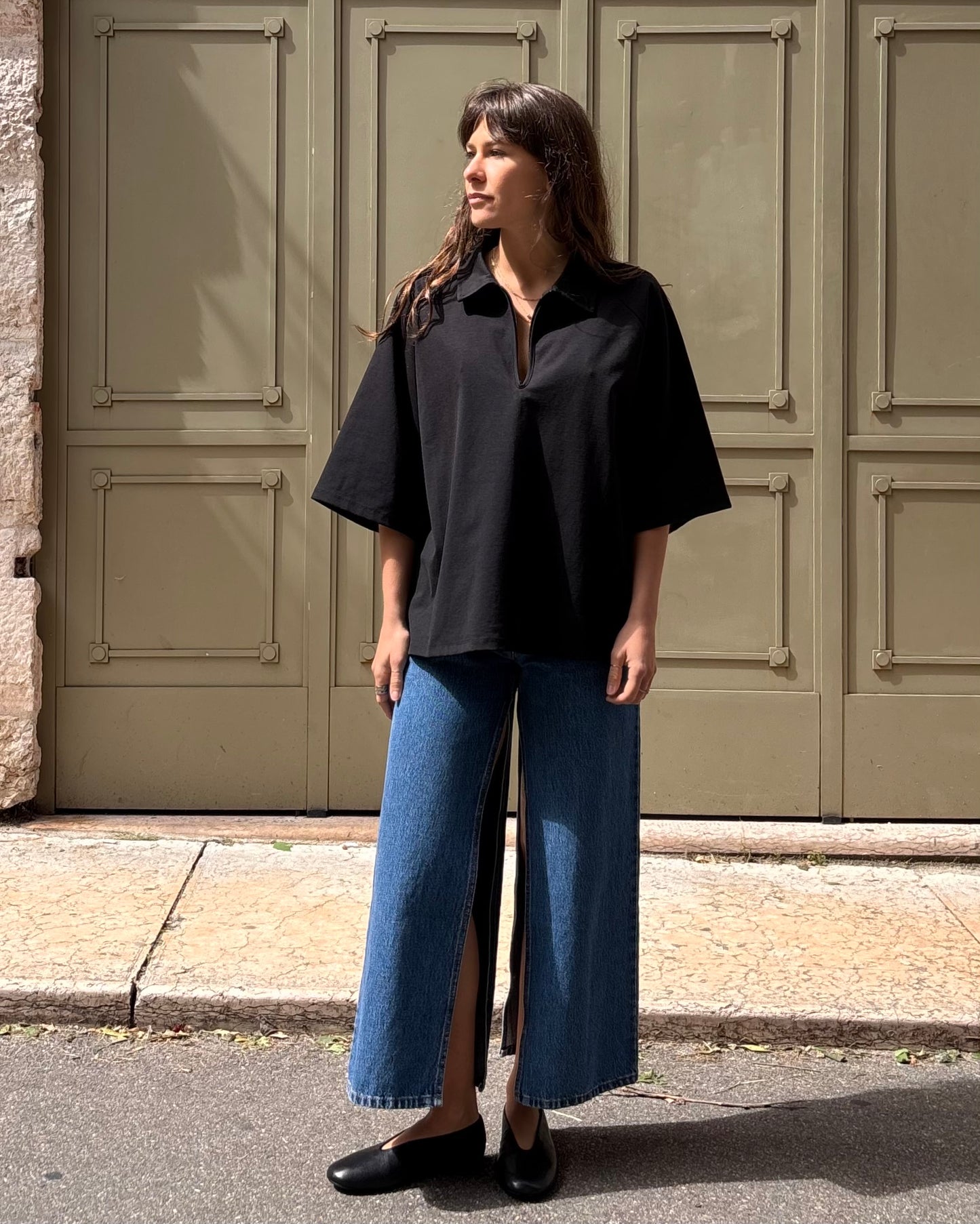 Polo con zip nera