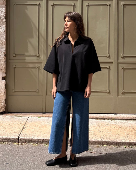 Polo con zip nera